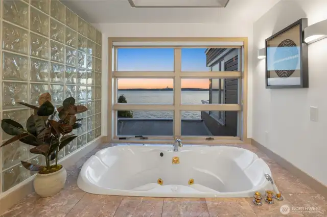 A spa-inspired escape: soak in the jetted tub while taking in tranquil sunsets and soothing lake views.