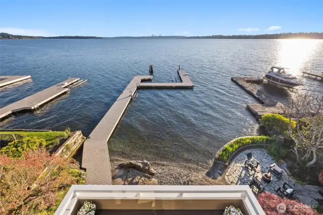 Let the sound of gentle waves soothe you from your private deck, overlooking a pebble shoreline and your own dockside retreat.
