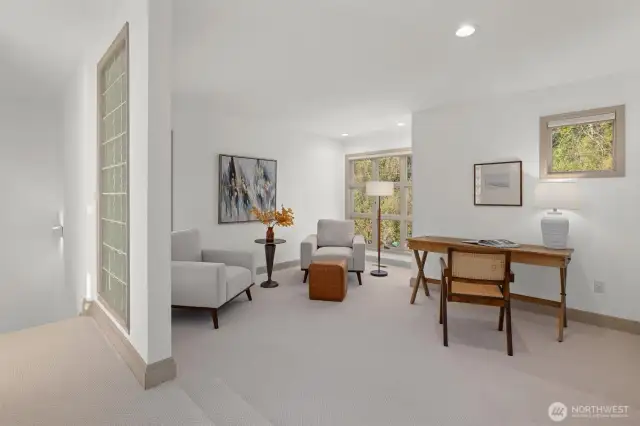 Spacious upper-level office or lounge just off the primary suite—ideal for work, reading, or relaxing in privacy.