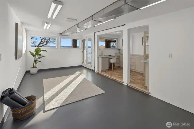 Expansive lower-level space ideal for a home gym, water toy storage, or even a future kitchenette—endless potential awaits.