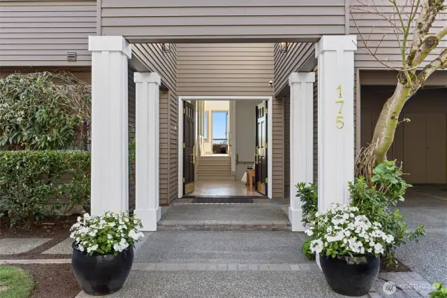 A stately, welcoming entry opens to endless views of Lake Washington, the Seattle skyline, and the majestic Olympic Mountains.