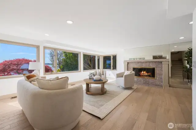 Bask in natural light and sweeping lake views from this expansive living room—where elegance and the outdoors meet in perfect harmony.