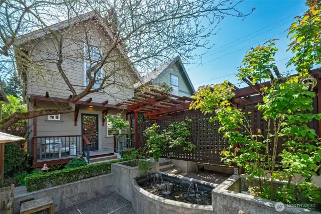 Front of home from the beautiful and lovingly manicured courtyard. Welcome home.