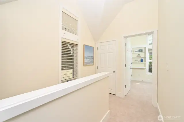 Upstairs offers vaulted ceilings and ample light making this home feel spacious and bright.