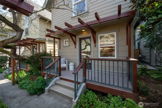 The front porch welcomes you home to this very special and spacious in-city retreat surrounded by lush landscaping and a beautifully maintained courtyard. The mature greenery provide year-round beauty with vibrant colors that change with the seasons.