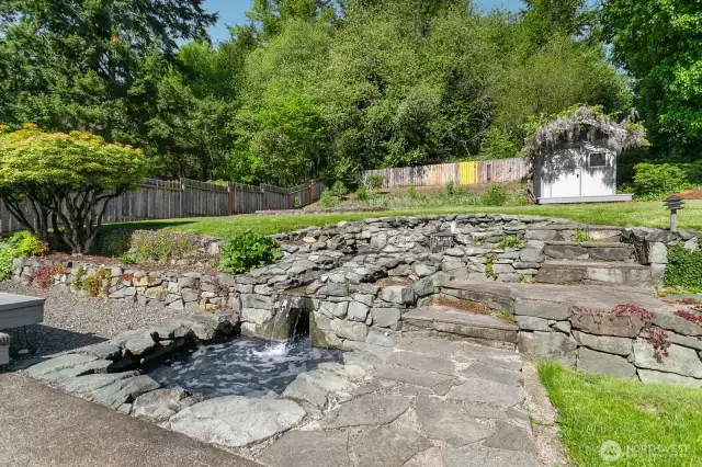 Beautiful landscaping and peaceful pond in back yard