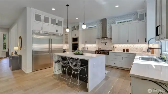 Looking back toward the entry and dining room capturing the exceptional flow of the main level.