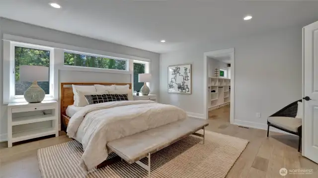 With the natural light beaming through the windows and light finishes this room provides a calm feel. To the right is a custom closet with all the room you'll need and to the left is a beautiful en-suite.