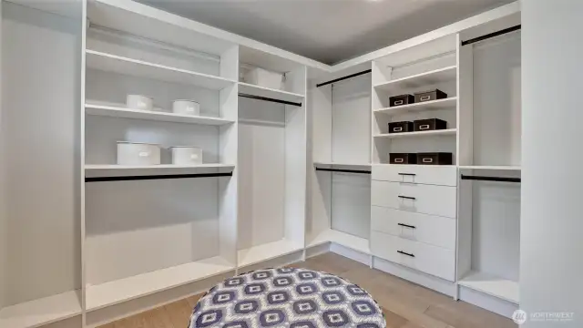 Second side of the primary closet with more built-ins and organized space waiting for you to make your own.