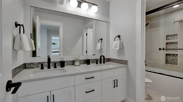 Upper level main bath offers a separate water closet and an abundance of stylish details.