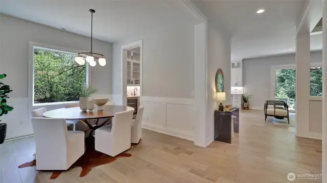 From the entry this view showcases the beautiful hardwood floors and flow into the main living area. To the left you'll find the den/office.