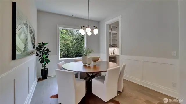 Another angle of the formal dining room with large picture window and seamless flow into the Butlers pantry.