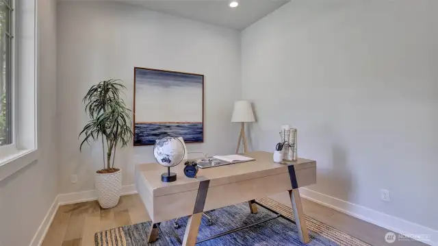 Conveniently located den/office on the main level with an abundance of natural light and tucked next to the entry of the home.