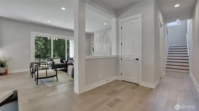 More views of the great flow this floor plan has. These gorgeous hardwoods run throughout the main level and continue up to the second level. To the left before you reach the stairs is a half bath and junior suite with private bath.