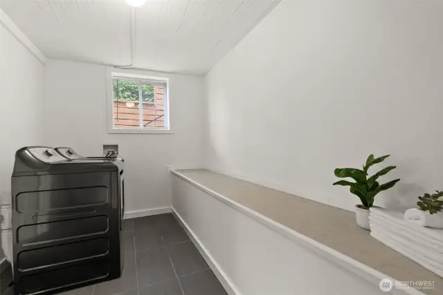Laundry room located right off the bonus area on the lower level.
