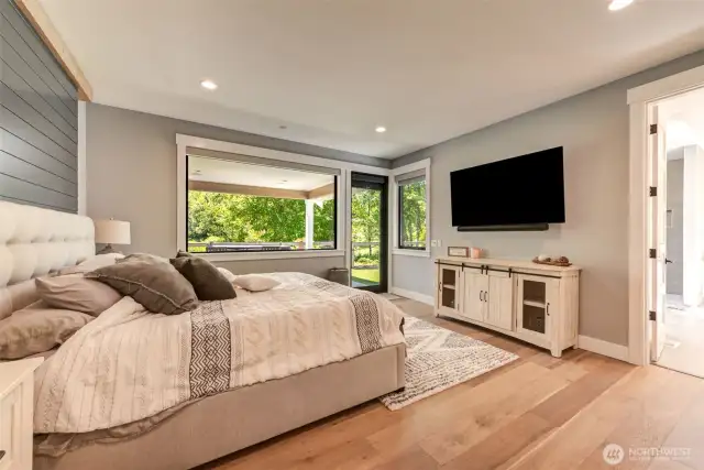Primary Bedroom. Door directly to hot tub area & patio.