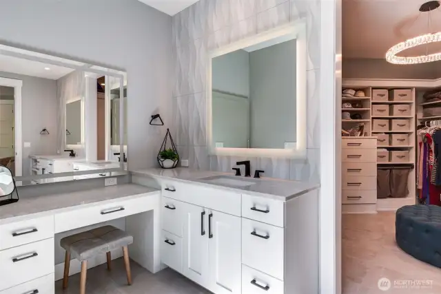 Two separate sink areas, this one with dressing area and bench.