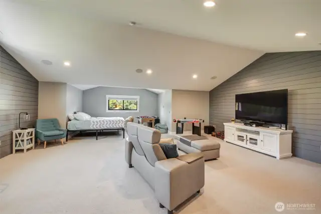 Upper floor bonus rec room is substantial. Could convert the far area into a formal bedroom & still have a very large room.