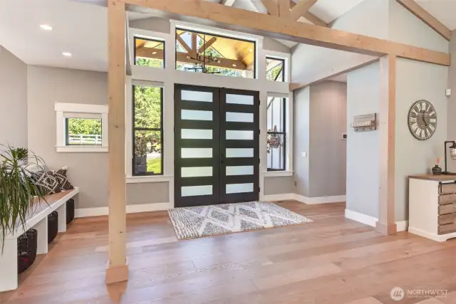 The front door. Engineered hardwood flooring used extensively.