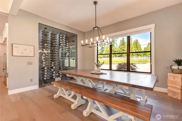 Dining room with wine display area that is humidity & temperature controlled.