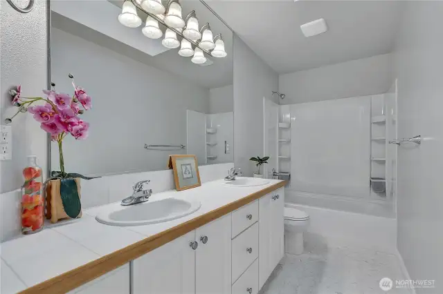 The spacious upstairs full bath, with dual sinks.