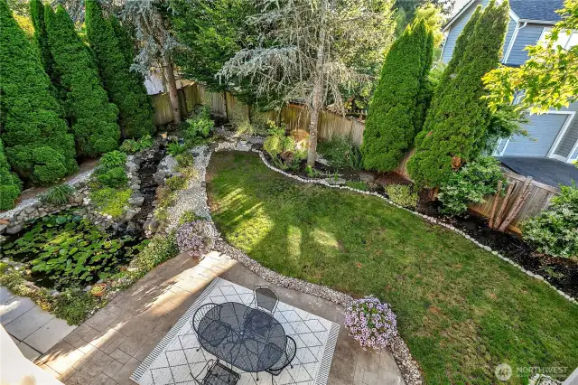 The entire yard is professionally landscaped and manicured.