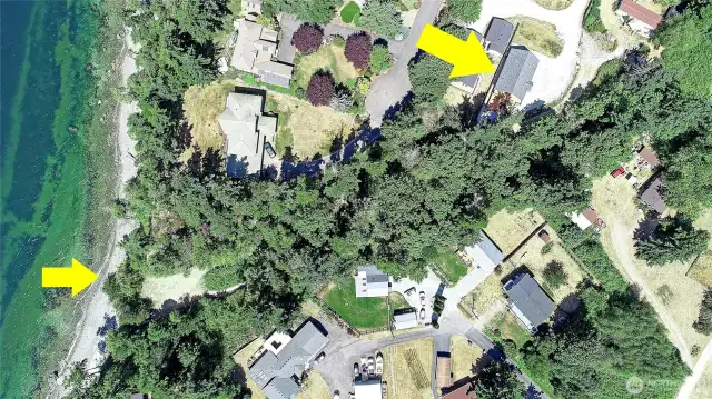 State land with beach adjacent to home