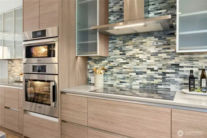 The Zephyr professional hood and a 36-inch Thermador 'Freedom' induction cooktop (flexibility to put your pans anywhere on the cooktop) were also added. A Bosch oven and steam/convention oven were installed as well.