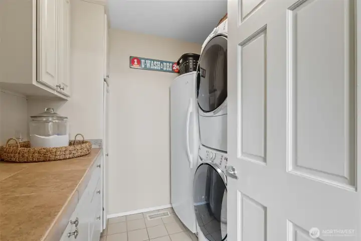 Main floor utility room with full freezer