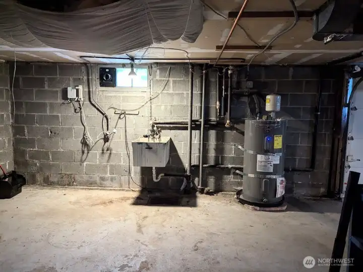 Utility sink, Rheem H20 tank.