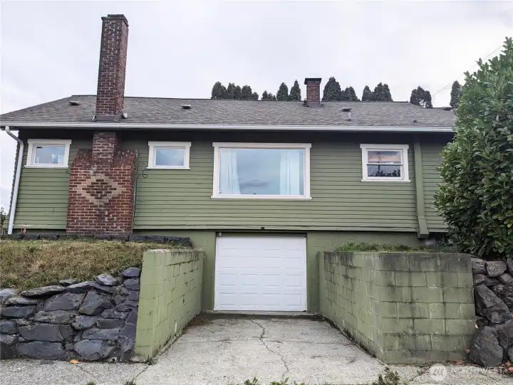 Great view of side of home & garage.