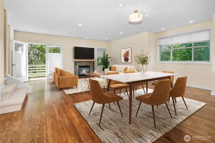 Main level has French doors to deck and gas fireplace. Virtually staged