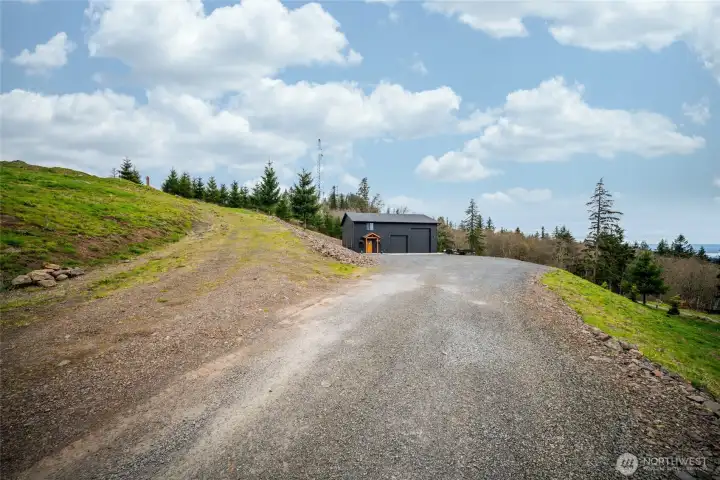Driveway to left goes up to the second building site.