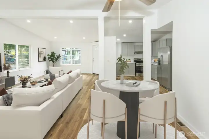 Dining room with a peak at kitchen *Virtually staged*