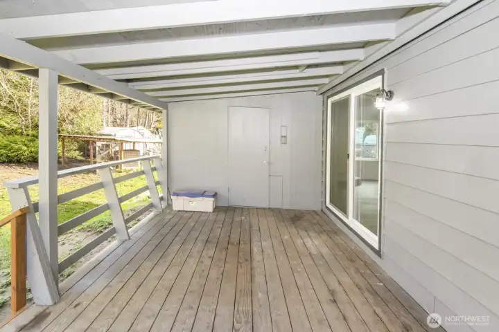 Back porch area with shed attached for added storage space