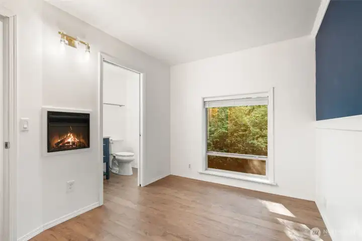 Second bedroom/office has its own half bath/wall fireplace