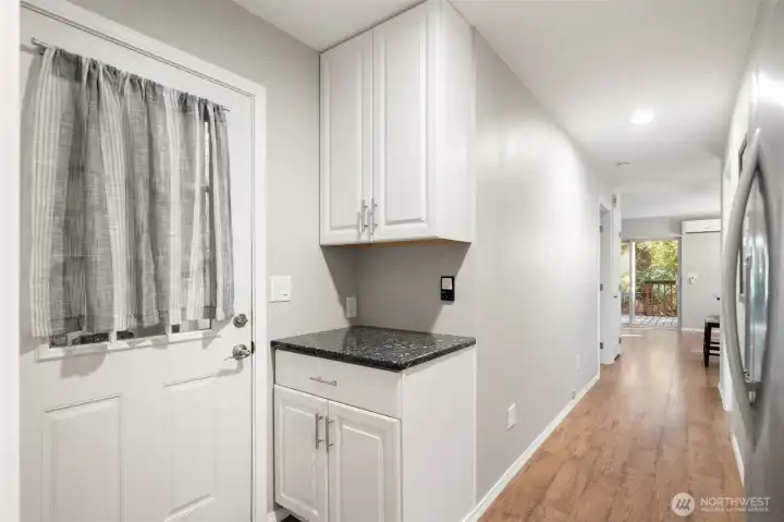 Hallway from second bedroom toward kitchen.  Home comes with second large refrigerator/freeze in this hallway.