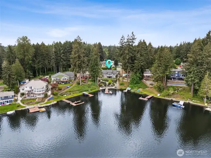 Tucked into the corner of this quieter cove-like section, the home enjoys a more peaceful setting removed from the heaviest concentration of fast-moving boat traffic, giving the waterfront a calmer, more serene atmosphere for relaxing, swimming and soaking in the views. But the beauty is you are not isolated from the fun at all. Step onto the dock and within moments you are right out into the main body of the lake ready for wake-surfing, tubing, wakeboarding, paddleboarding or long sunset cruises. At roughly 307 acres, Long Lake is large enough to genuinely enjoy motorized lake recreation while still maintaining the beauty and community feel people love about waterfront living. It is the best of both worlds, peaceful where you live and playful whenever you want it to be.