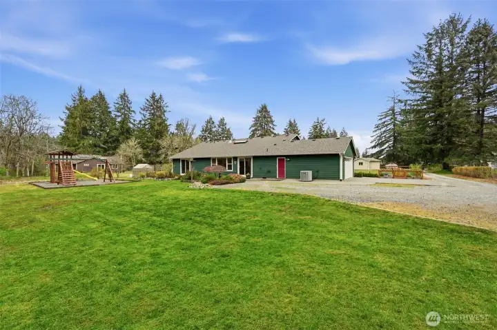 2 Car Garage also with Tons of additional graveled parking, heat pump to keep you cool in the summer and playground!