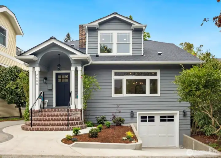 1 Car garage, driveway, and additional parking pad on left
