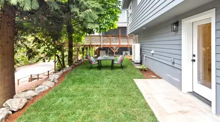 Brand new sod, and arborvitae, very private backyard