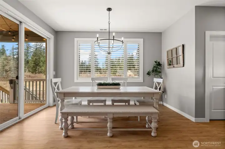 Flooded with natural lighting, enjoy the extra space designated for dining with access to the covered patio through an additional set of sliding glass doors.