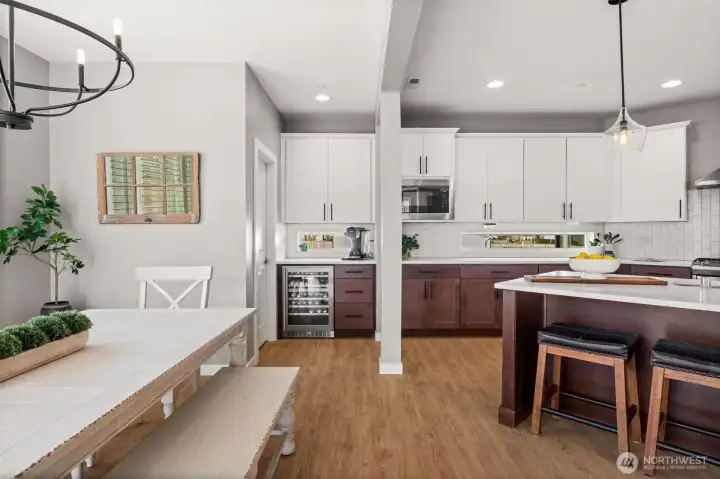 This kitchen features a walk-in pantry and beverage fridge!