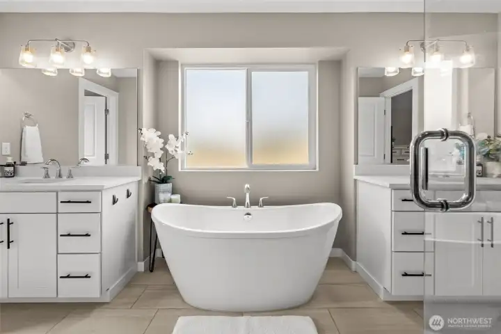 With a fogged glass window, this elegant free-standing tub blends comfort with the privacy you deserve!