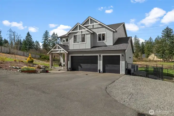 Drive down your private driveway to additional and oversized parking, with up to 6 uncovered parking spaces as well as 3-car covered garage parking!