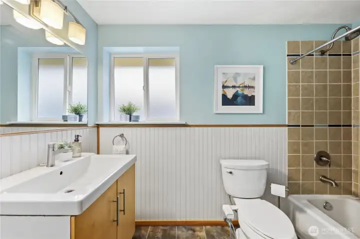 Updated bathroom has heated tile floors.