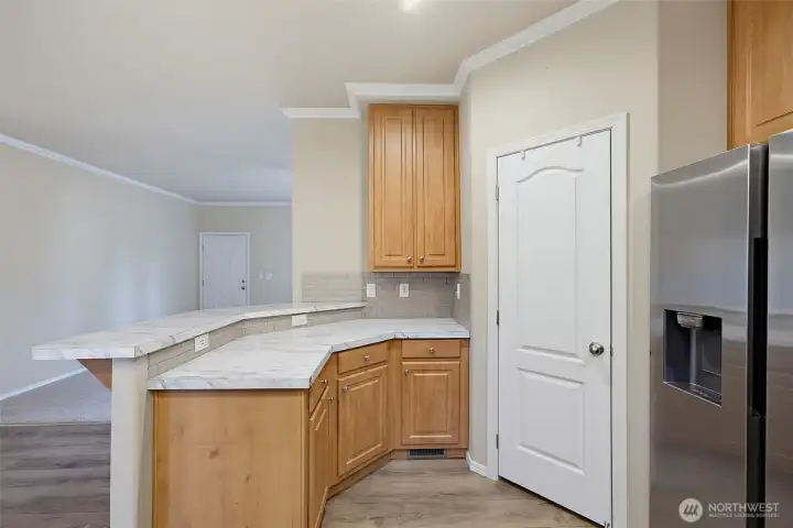 Cabinets to the Ceiling, Large Pantry and SS Appliances.