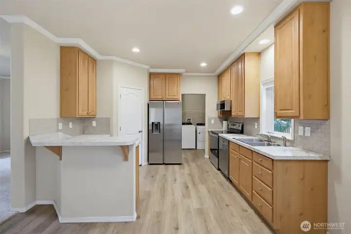 Beautiful Kitchen. Note the Large Pantry next to the Refrigerator.