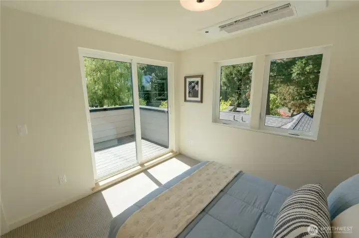Bedroom #4 Slider to the small deck and access stairs to the Lake Washington and Cascade Mountain View Roof Deck