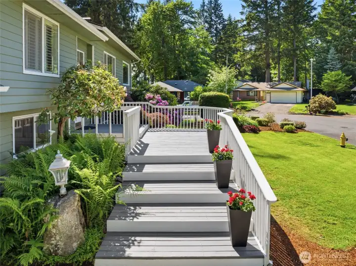 This expansive front deck, spanning approximately 700 square feet, creates an inviting outdoor space perfect for enjoying your morning coffee, relaxing with a good book, or simply taking in the peaceful surroundings. This expansive front deck, spanning approximately 700 square feet, creates an inviting outdoor space perfect for enjoying your morning coffee, relaxing with a good book, or simply taking in the peaceful surroundings.
